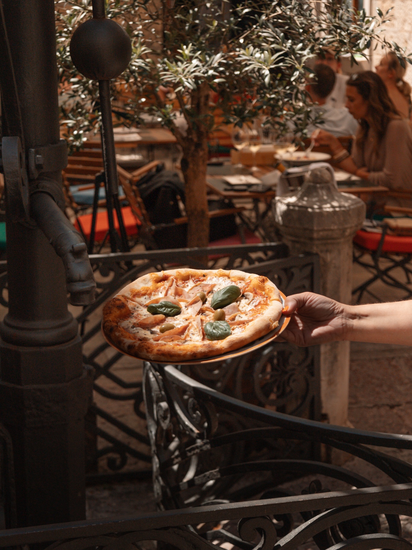 Wood-fired pizza under the olive tree
